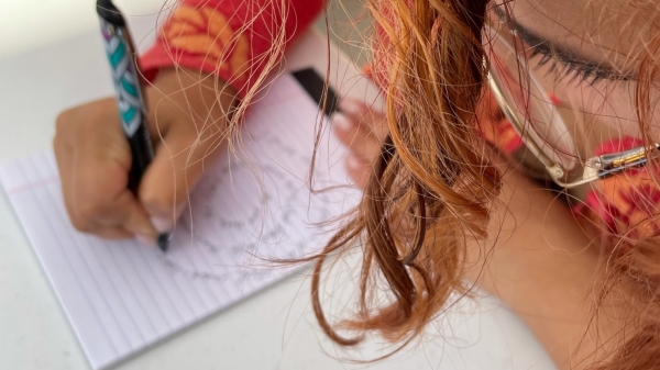 Aida Campos writes in a spiral during a Humanities Week event on the ASU campus, October 19, 2021. / Photo courtesy Sally Ball.