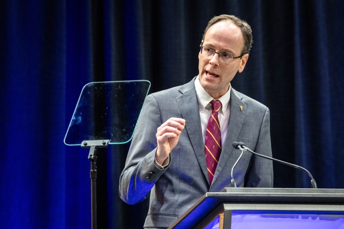 Man speaking at lectern