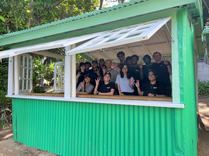 Photo of GlobalResolve students in refurbished gardening shed