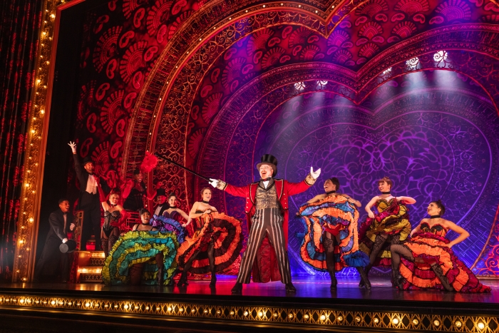 Cast of Moulin Rouge musical dancing on stage