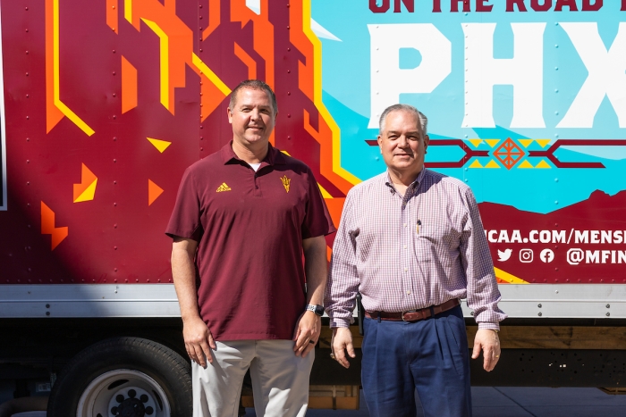 J.D. Loudabarger (left), Associate AD, Operations and Facilities, and Mike Chismar, Sr. Associate AD, Operations & Facilities, stand by the Arizona Final Four truck at the Final Four Preview on Mar. 16, 2024. (Photo by Emma Fitzgerald/Arizona State University)