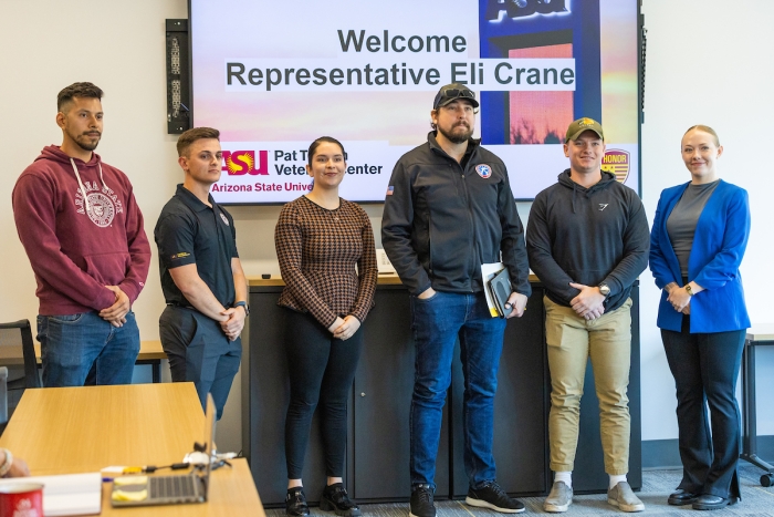 State Representative Eli Crane takes a photo with ASU student veterans.