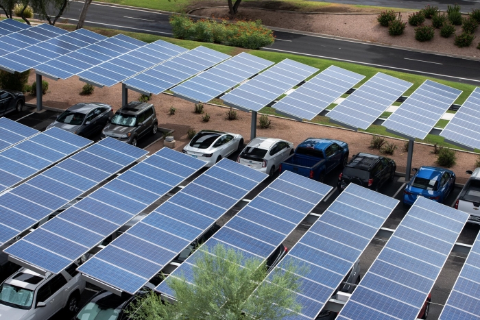 Rooftop view of a parking lot with solar shading panels.