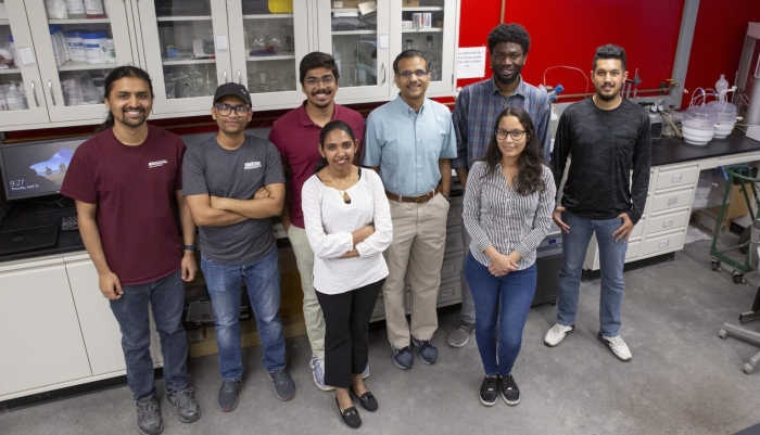 Group photo of researchers in a lab.