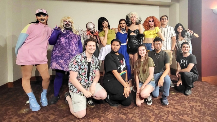Out in STEM members pose with drag queens