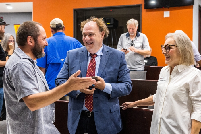 Photo of Dorene McCourt speaking with Krijn Paaijmans and Ferran Garcia-Pichel.