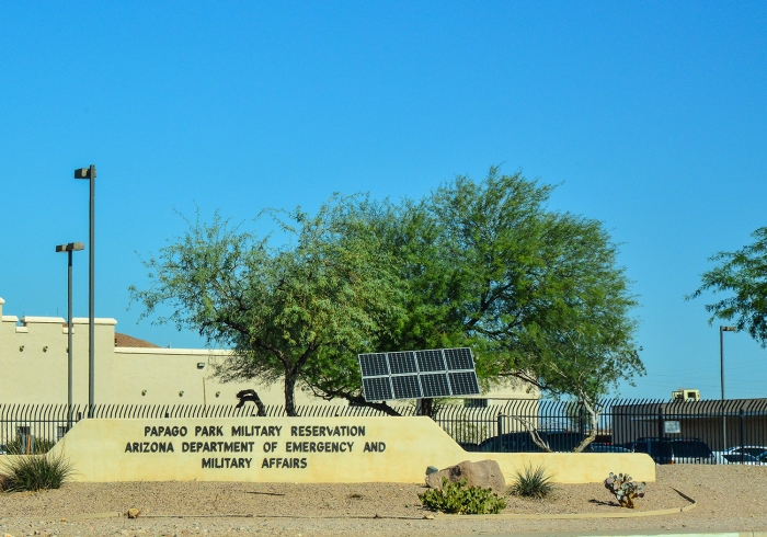 entrance to the Papago Park Military Reserve with a solar panel nearby and palo verde trees behind