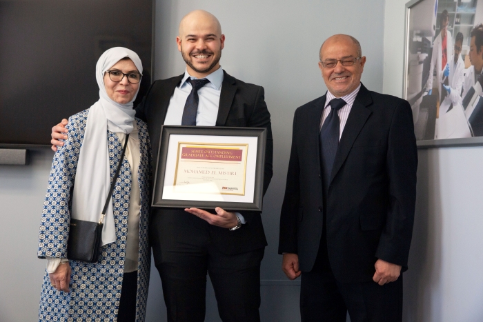 El Mistiri (center) and his mother and father (left to right) Hekmet Bugrein and Mufid El Mistiri.