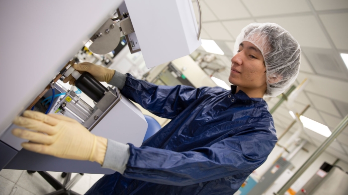 An ASU FURI student works on semiconductor research in the lab.