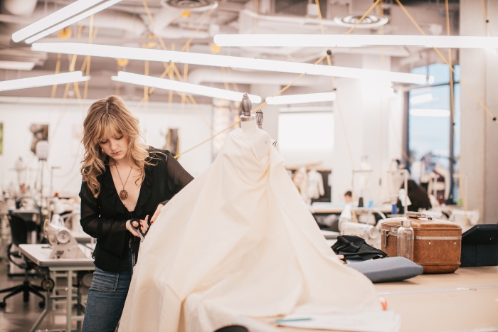 Photo of Lauryn Burr working in the studio. Photo by Camille Misty.