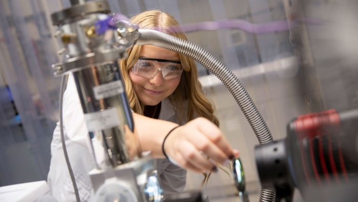 An ASU FURI student researcher works in the lab.