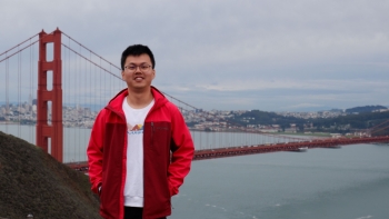 Man standing in front of the Golden Gate Bridge.