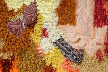 Close-up image of textiles of varying colors and textures.
