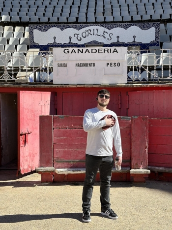 Lucas Glick stands inside a bull fighting ring in Barcelona, Spain