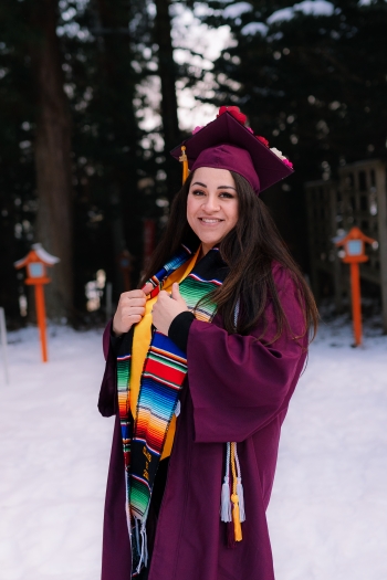 Shannon Zellner celebrates her graduation, dressed in a cap and gown in a snowy Japan 