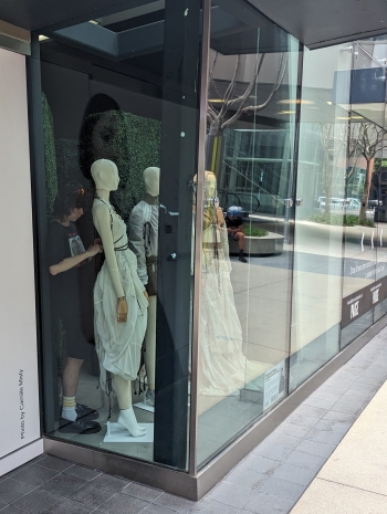 Photo of Ethan Jimenez working on a window place at Santa Monica Place.