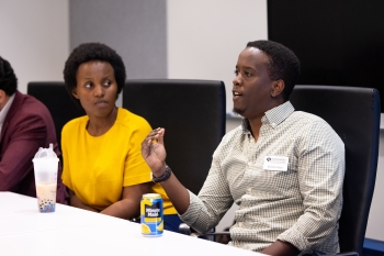 A woman and a man sit in a classroom