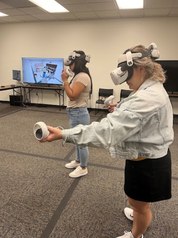 Central Arizona College staff participate in a virtual reality demonstration of an emergency room scenario. Mercado Center, Downtown Phoenix campus.