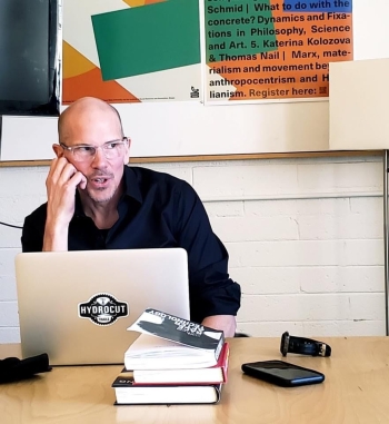 Marcel O'Gorman sitting with a laptop in front of him.