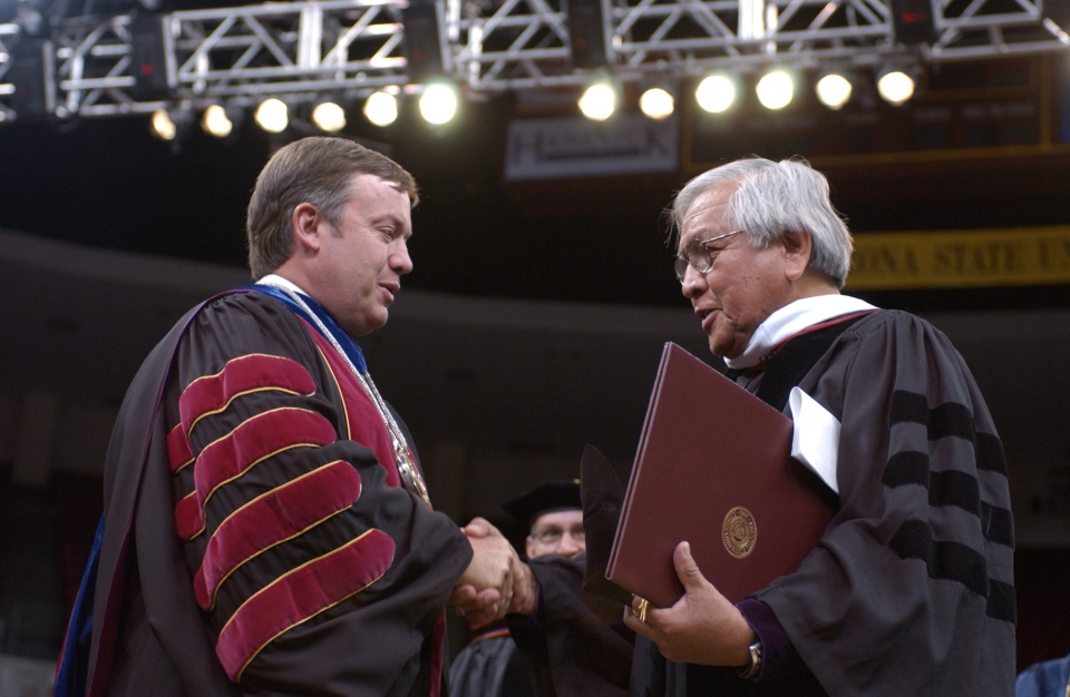 ASU President Crow and Peterson Zah shake hands during commencement ceremony