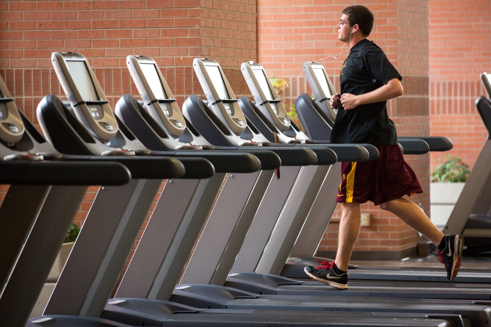 student running on treadmill