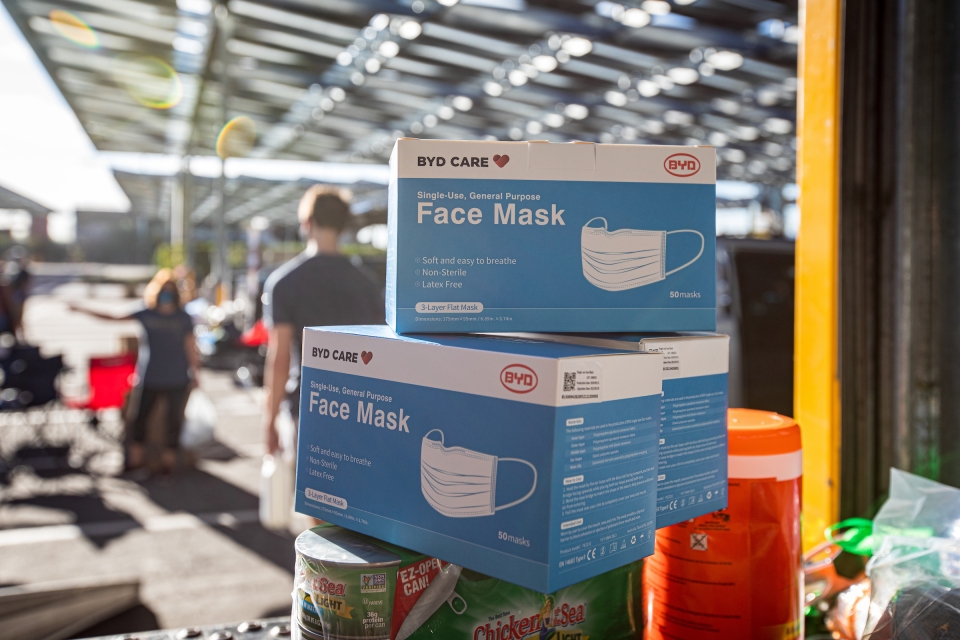 face masks sit on a stack of boxes