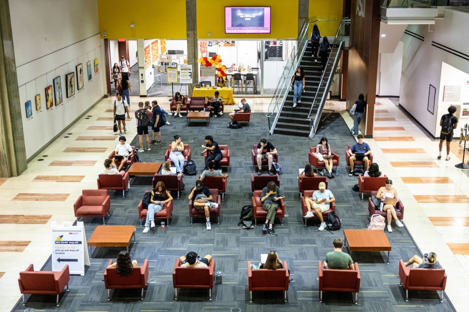 View from above of students sitting in chairs in an ASU lobby