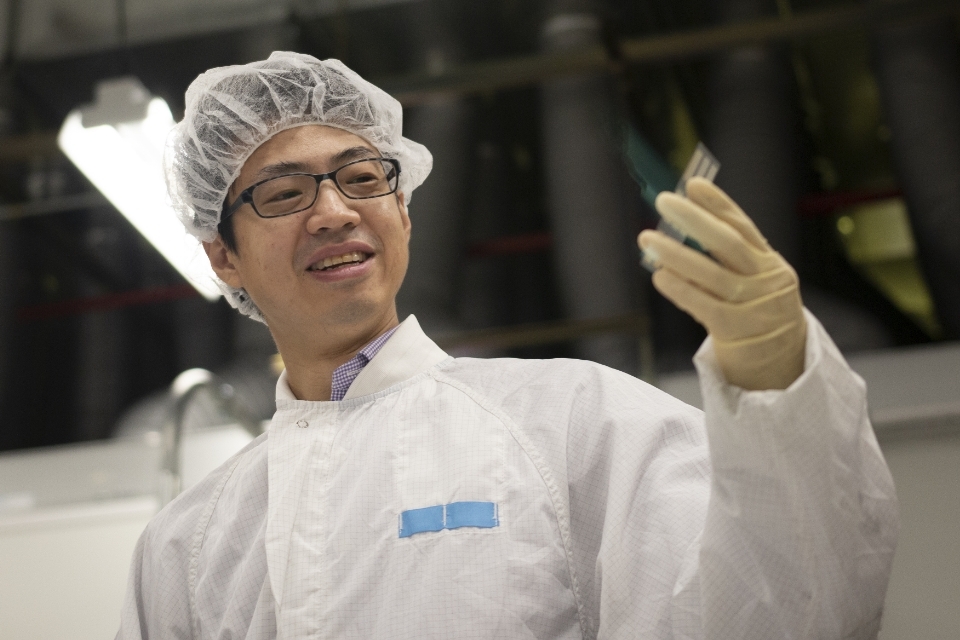 Man holding solar chip in lab