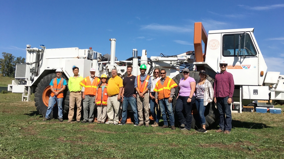 Geotechnical engineering team with T-Rex ground shaker at test site in Oregon