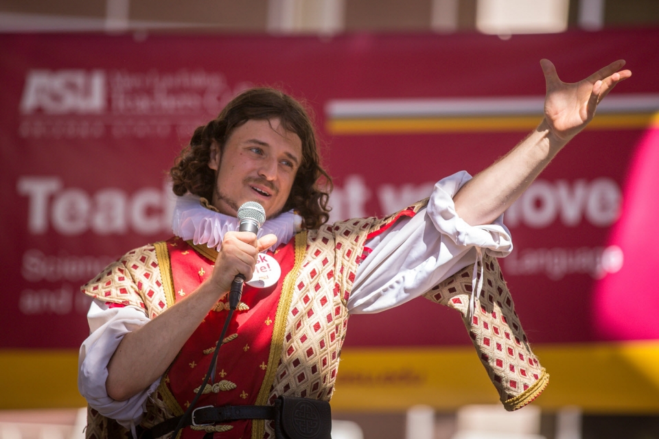 ASU student Noah Brown recites a speech from Shakespeare's "Henry V" at a Mary Lou Fulton College fair outside the Memorial Union in 2016. Photo by Charlie Leight / ASU News.