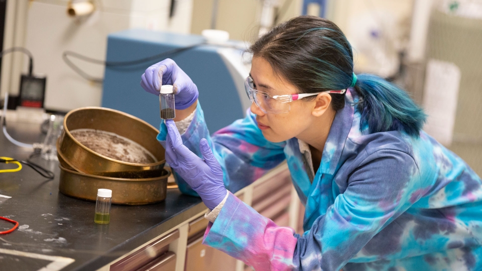 ASU chemical engineering student Kelly Nguyen works in the lab as part of a FURI research project.