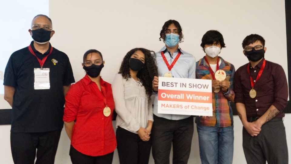 Professor Ganesh (at left), poses with winning team at recent MAKERS of Change Assistive Technology Challenge. 