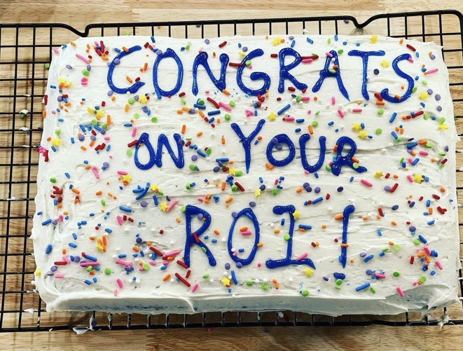 Cake decorated with confetti and the words CONGRATS ON YOUR R01!