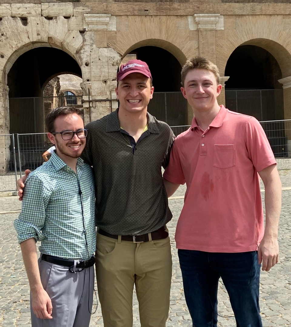 Jonathon Hofer (center) during a trip to Rome with his students.