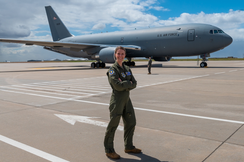 Courtesy photo of ASU graduate  in Air Force uniform with a KC-46 in the background.