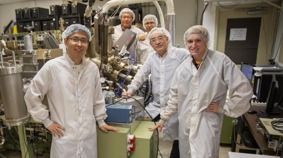 people posing for photo in lab