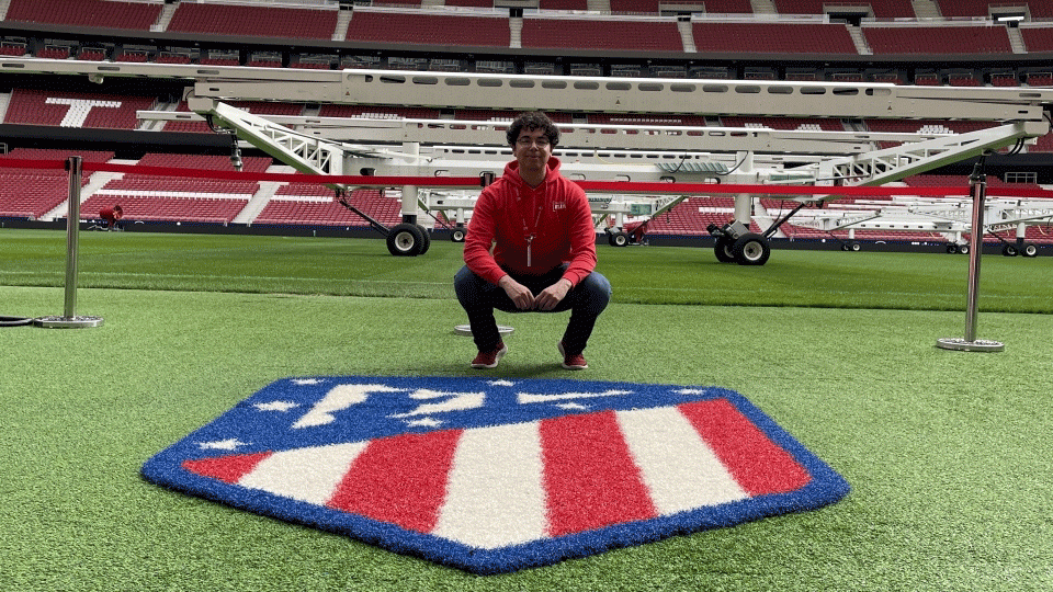 ASU student Alex Saldana on the Atletico Madrid soccer field.