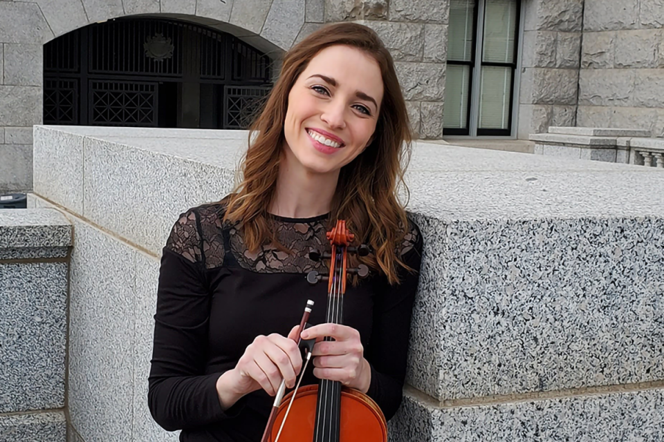 woman posing with violin