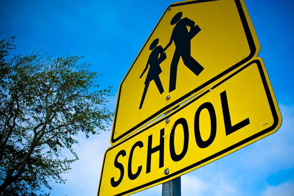 Image of a school crosswalk sign / Photo credit Brian Matis on Flickr. Used under CC 2.0.