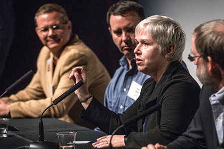 Scientists speak at a space event.
