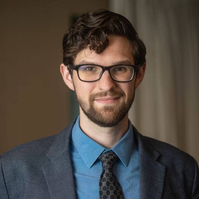 Portrait of ASU postdoctoral scholar Aaron Kushner.