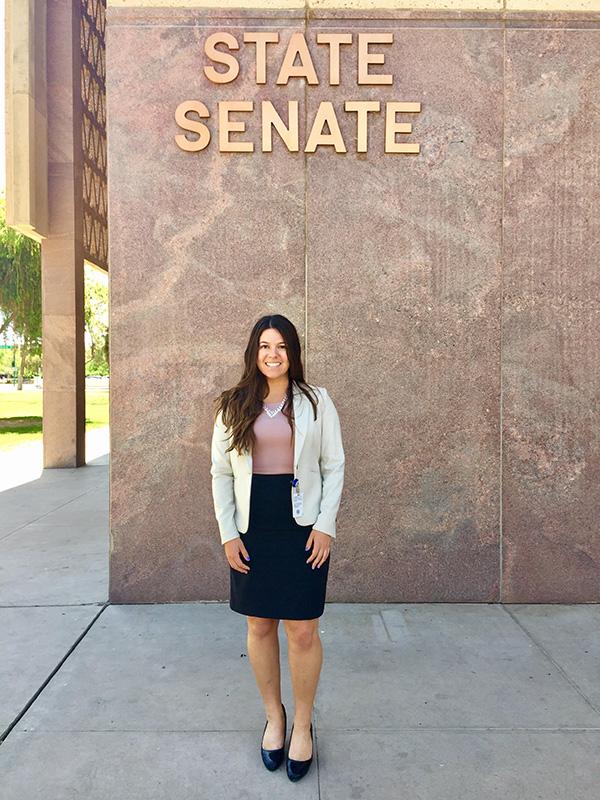 Andrea Lichterman in front of the Arizona State Senate building