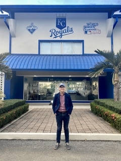  stands outside a Kansas City Royals baseball team facility.