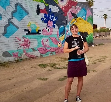 ASU Assistant Professor Danielle Foushee stands in front of a mural in downtown Phoenix
