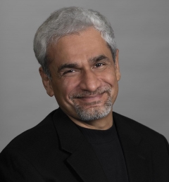 Man with gray hair and black shirt