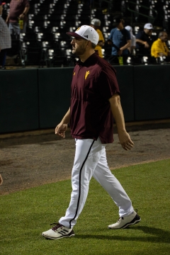 Baseball coach walking on field