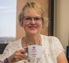 Woman posing with coffee mug