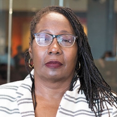 Black woman in glasses and braids
