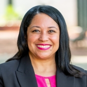 Woman in black jacket smiling