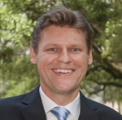 Man in suit and tie smiling